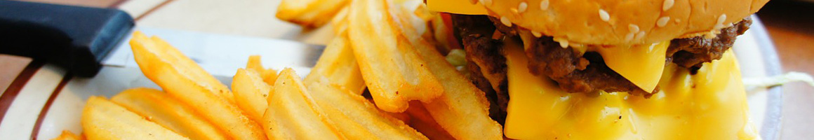 Eating Burger at Char-Burger Stockade restaurant in Kilgore, TX.